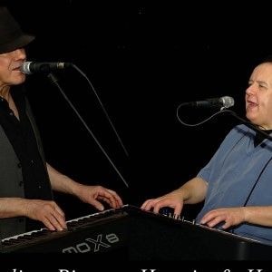 Hermie and Harry performing dueling pianos